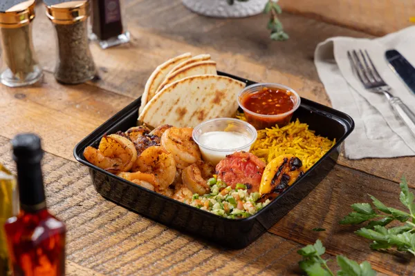 Grilled wild-caught shrimp kabob plate from Ikaria Kitchen